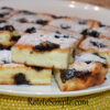 Slice of semolina pudding with golden crust and jam center