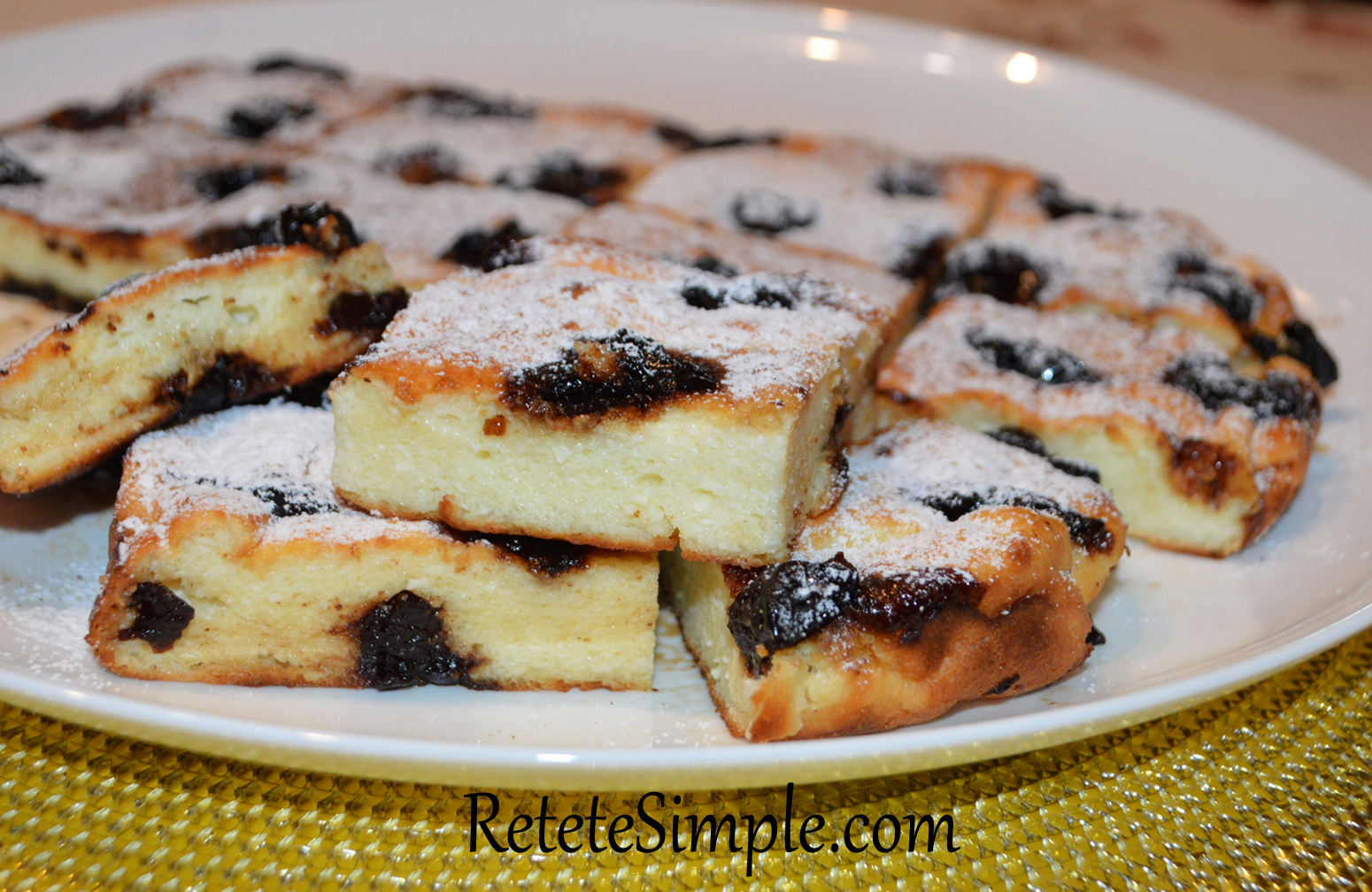 Slice of semolina pudding with golden crust and jam center
