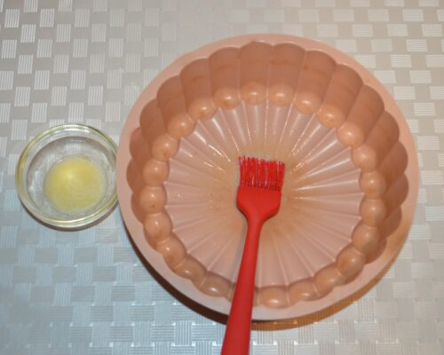 use a pastry brush to grease the mold