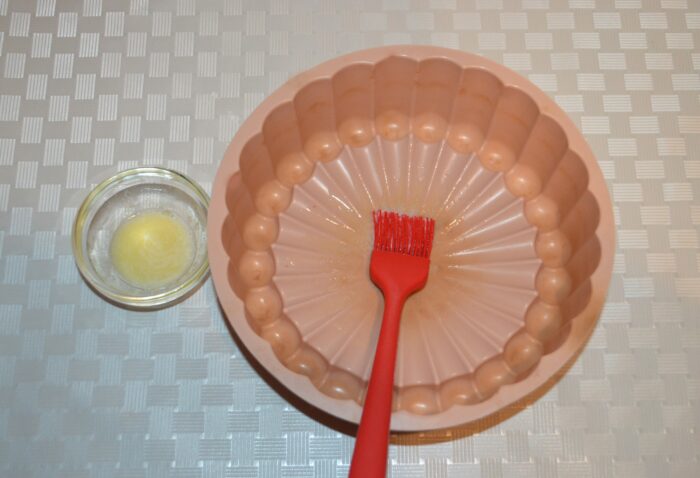 use a pastry brush to grease the mold