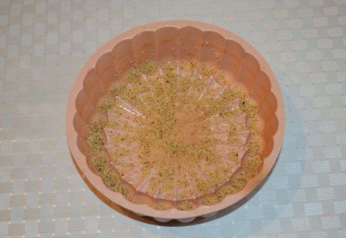 Sprinkle a little walnut into the greased mold