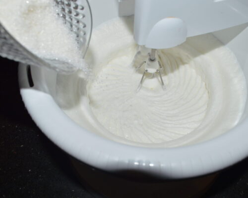 Beat the egg whites with a mixer until stiff froth