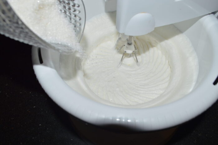 Beat the egg whites with a mixer until stiff froth