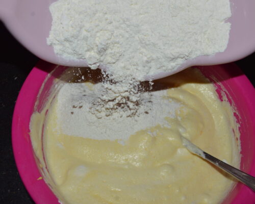 Then gradually pour in the egg whites and egg yolk mixture