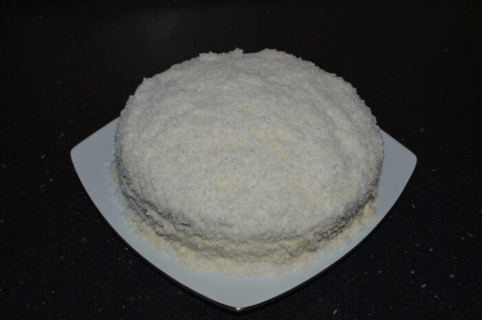 Sprinkle coconut on top and sides