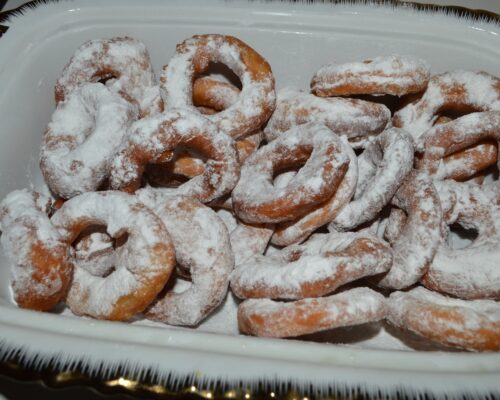Sprinkle the donuts with powdered sugar