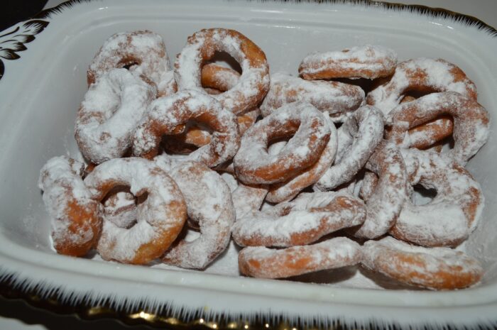 Sprinkle the donuts with powdered sugar
