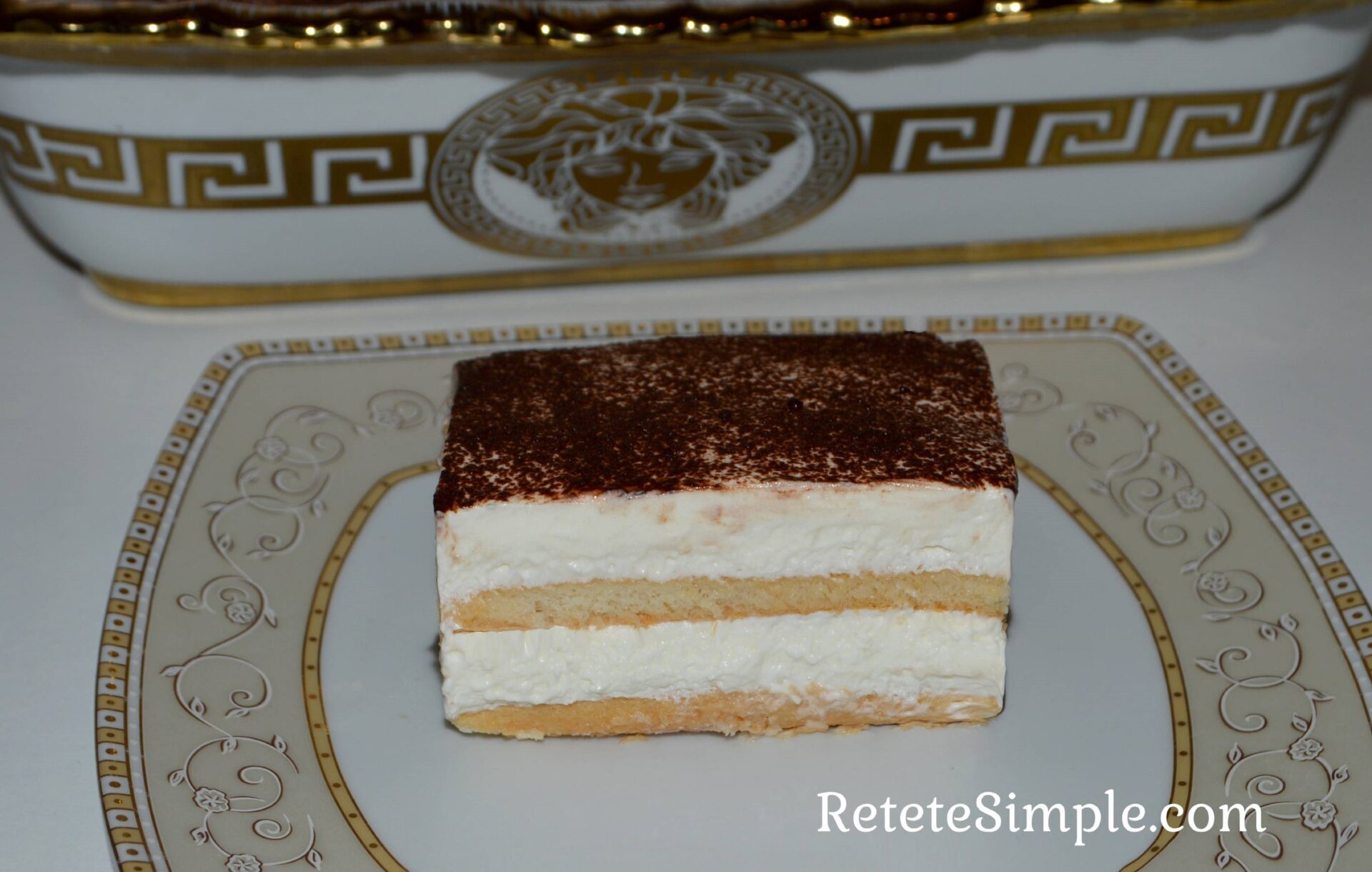 No-bake ladyfinger cream cake on white plate image