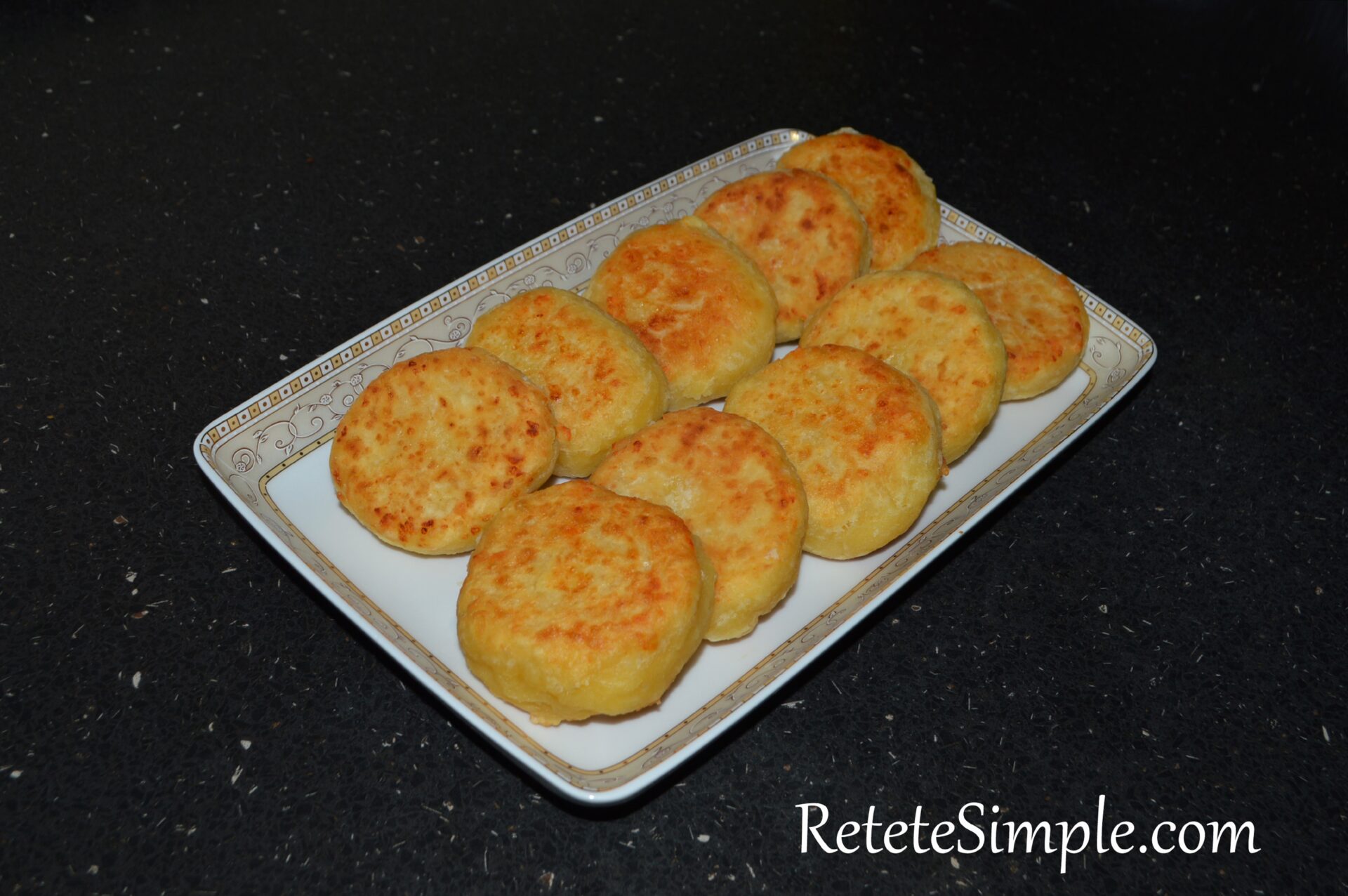 Frying cottage cheese pancakes on plate
