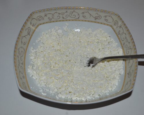 Mash the cottage cheese with a fork