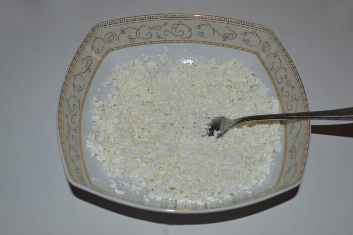 Mash the cottage cheese with a fork
