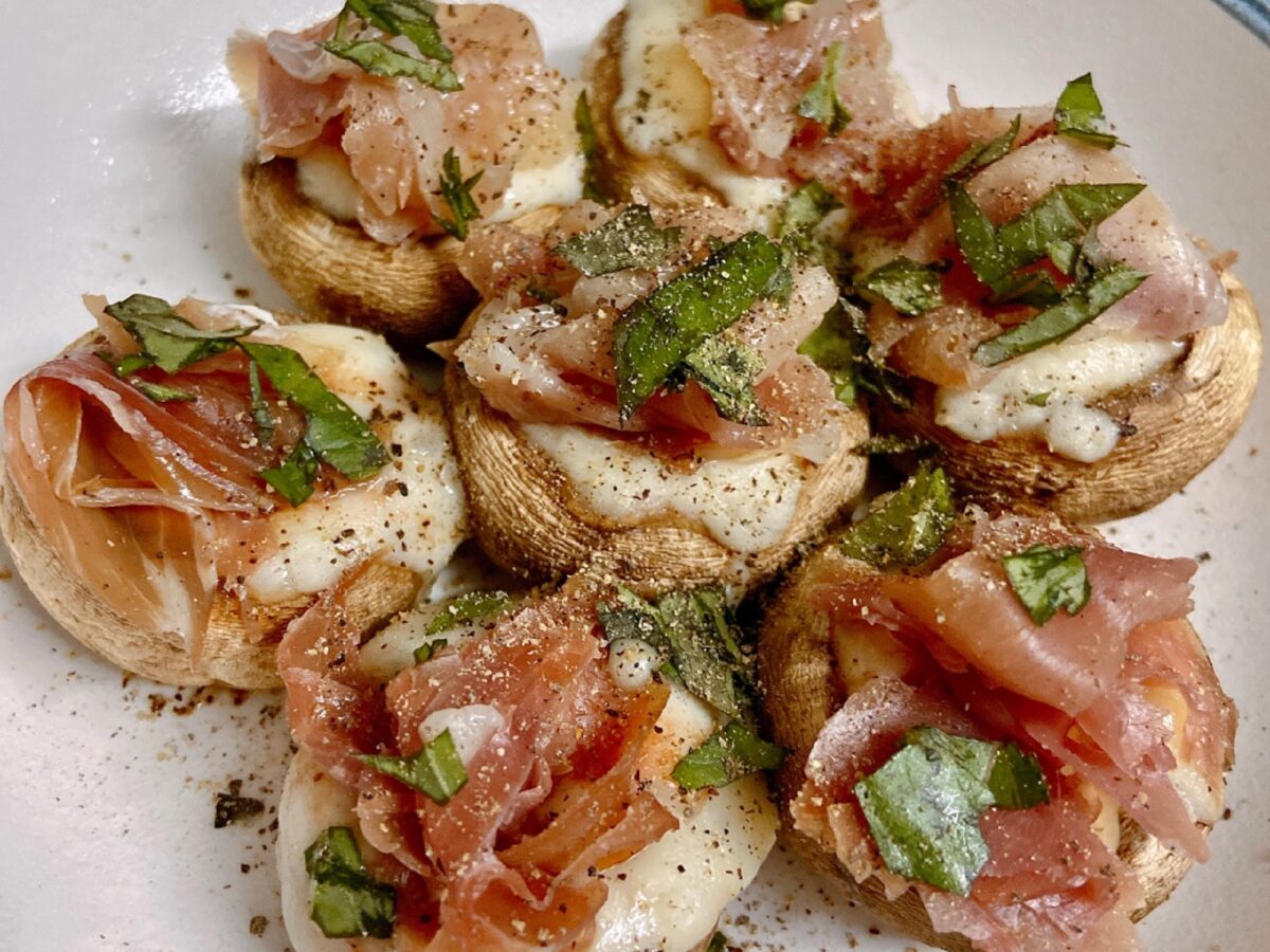Cheese-stuffed mushroom caps fresh from the oven