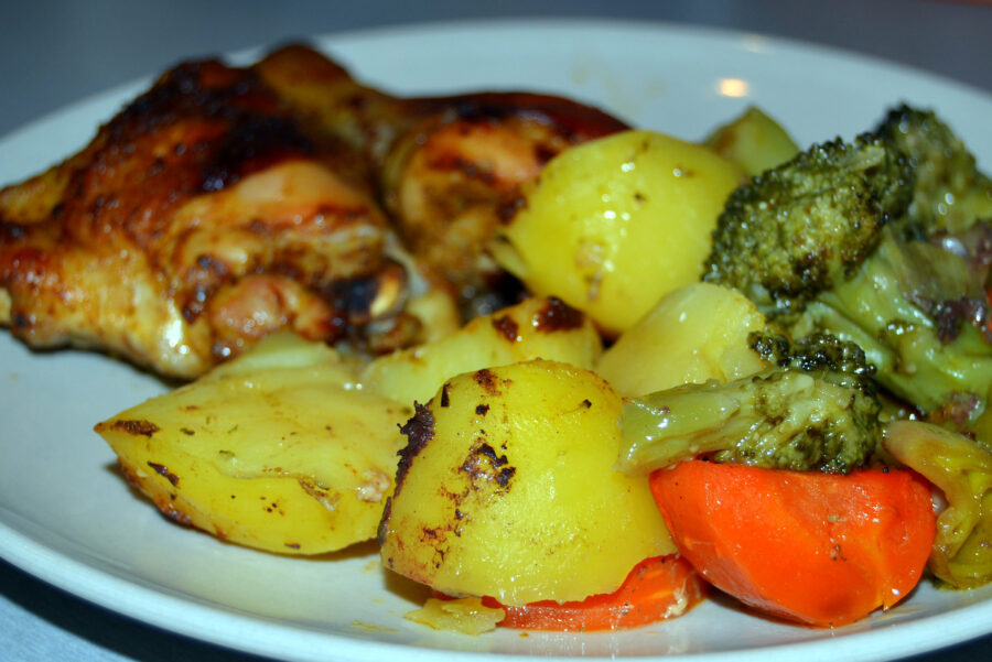 Chicken thighs with potatoes and vegetables baked in oven roasting bag