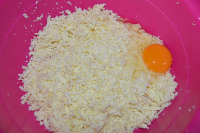 shave the salted cheese and add an egg
