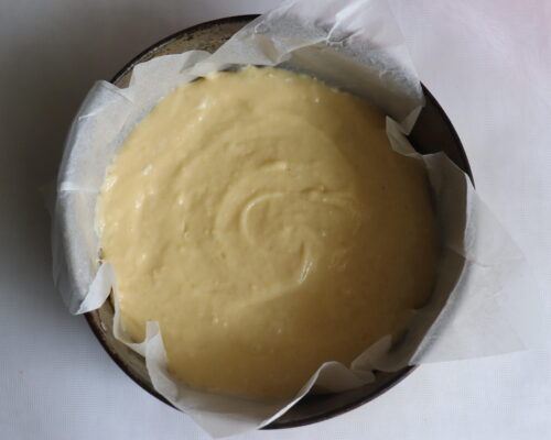 Pour some of the dough into the pan