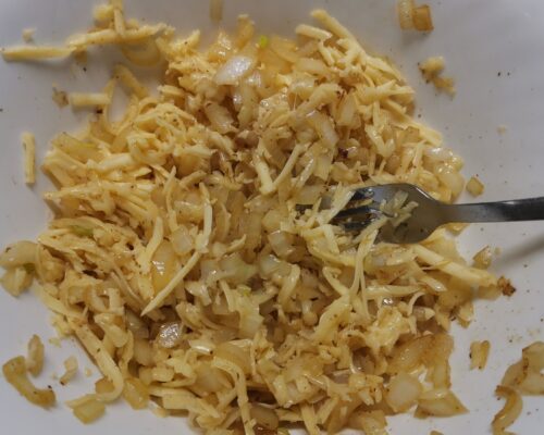 Grate cheese on a coarse grater