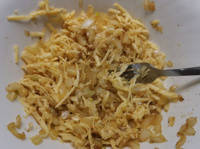 Grate cheese on a coarse grater