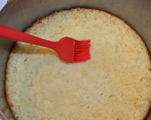 Using a pastry brush, grease the top