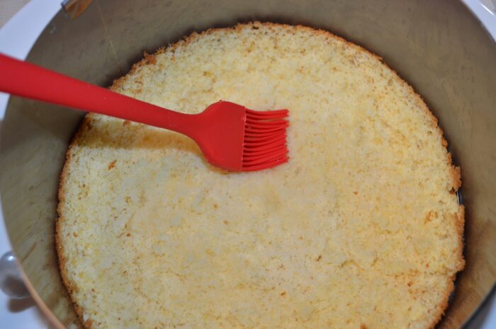 Using a pastry brush, grease the top