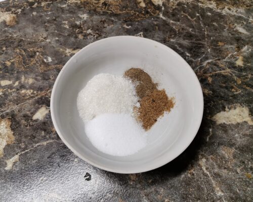 Mix salt, sugar, red, and black ground peppe