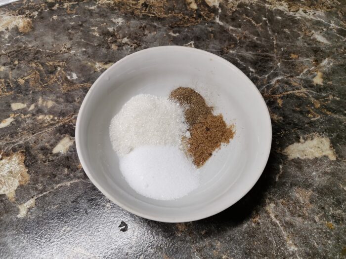 Mix salt, sugar, red, and black ground peppe