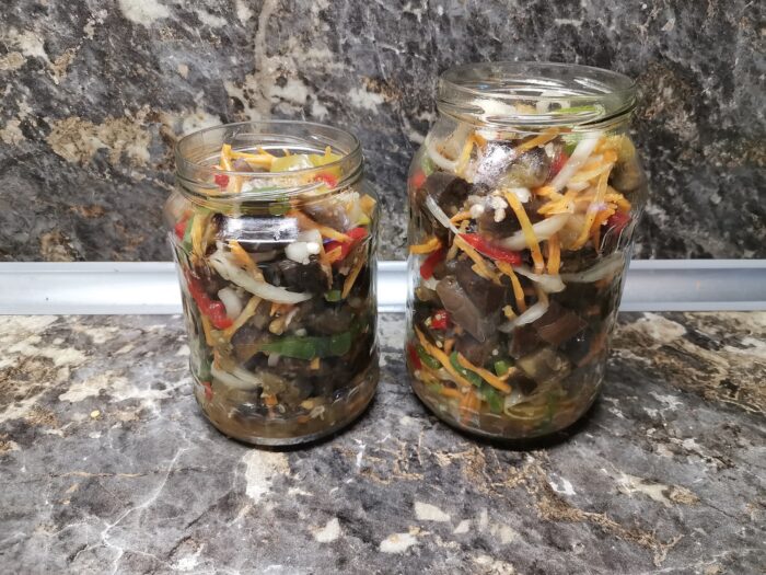 lay them out tightly in sterilized jars