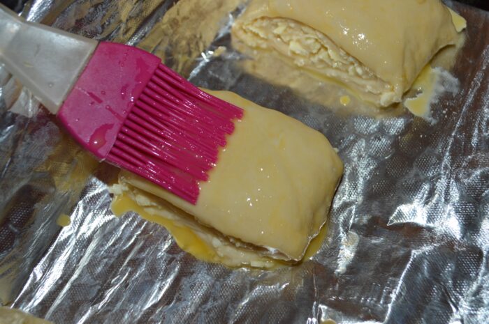 brush the pastry with a kitchen brush