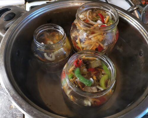 Set out the jars with the vegetables