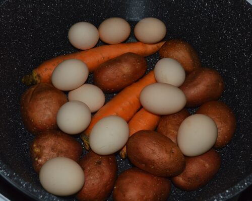 Boil the potatoes, carrots and eggs