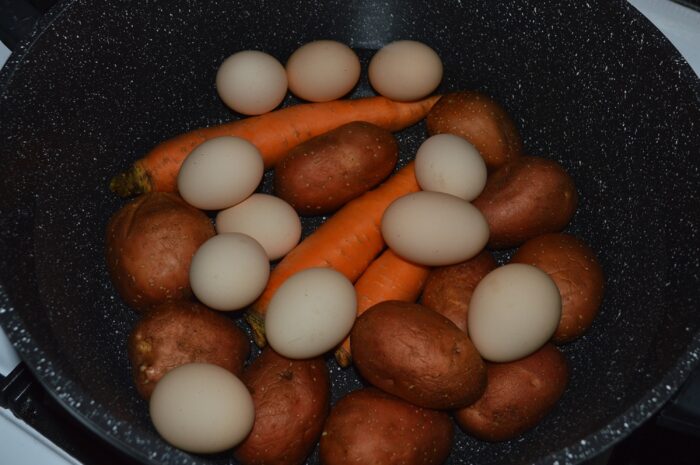 Boil the potatoes, carrots and eggs