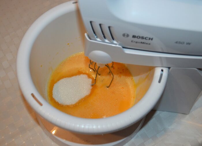 add the eggs and sugar to a deep bowl