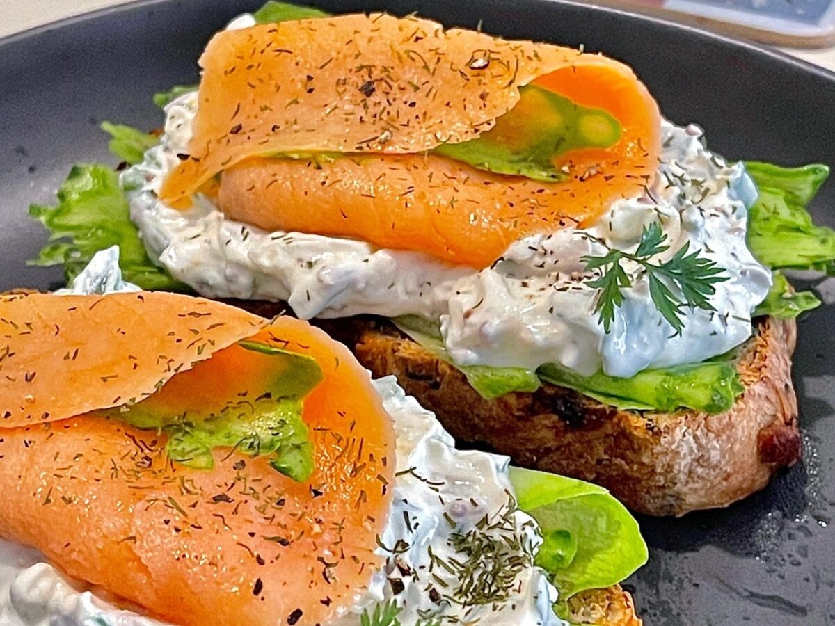 Open smoked salmon sandwich with cream cheese and cucumber
