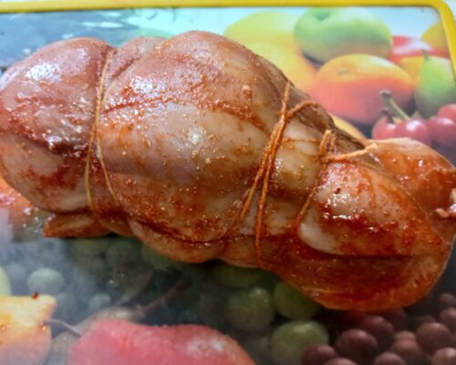 Tie the two pieces of chicken together