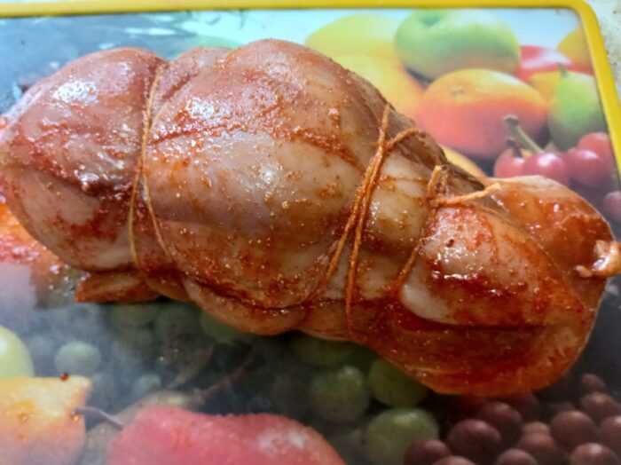 Tie the two pieces of chicken together