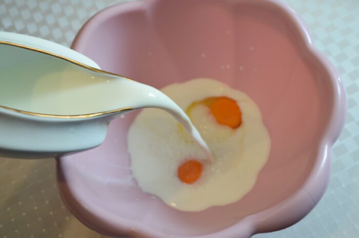 Pour in the milk and mix with a whisk