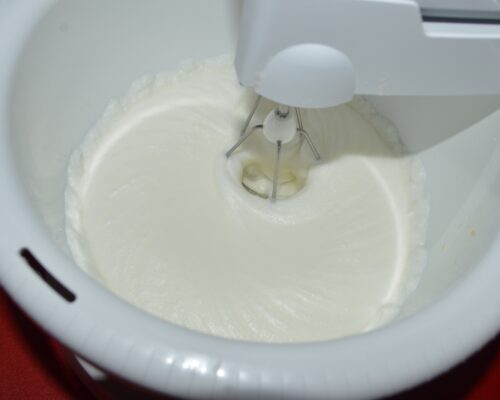 Beat the egg whites until stiff peaks form