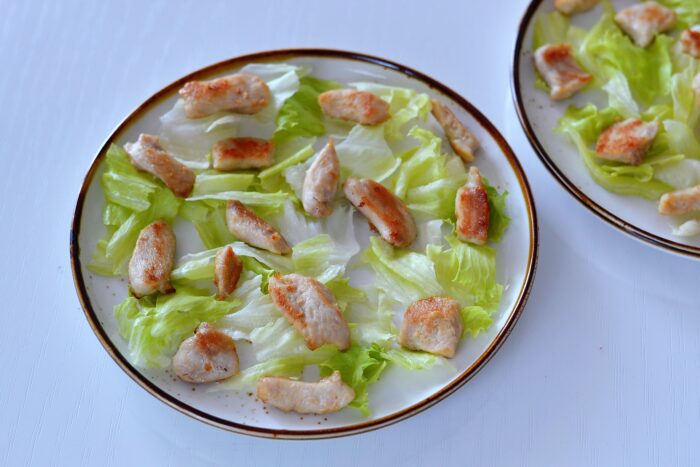 Cut the chicken fillets into small slices and then fry