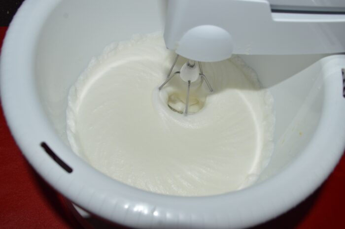 Beat the egg whites until stiff peaks form