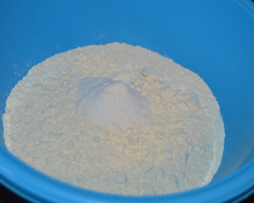 In a separate bowl, add the flour and baking soda