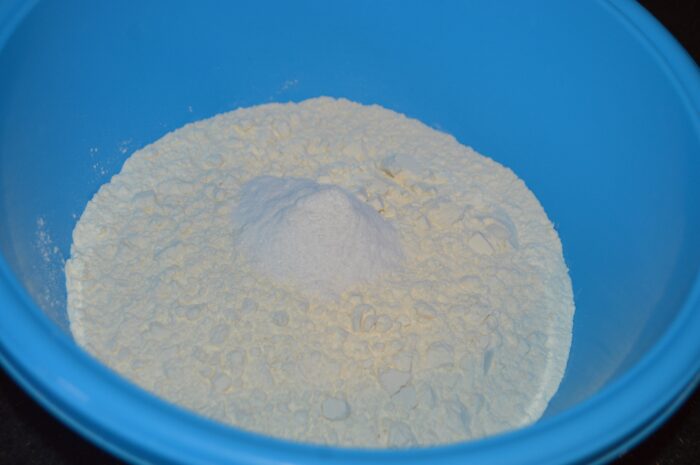 In a separate bowl, add the flour and baking soda