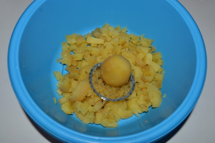 Using a vegetable cutter, cut the potatoes