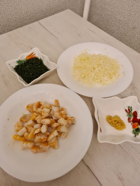 Finely chop the greens, peel the shrimp