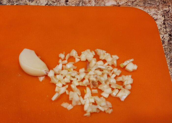 Peel the garlic and chop