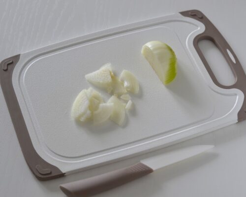 Peel the onion and cut
