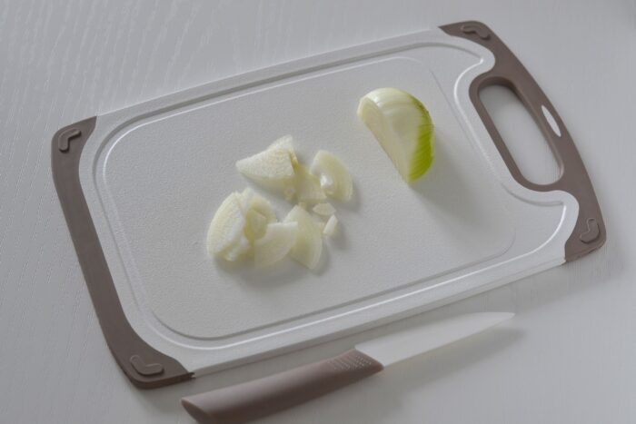 Peel the onion and cut