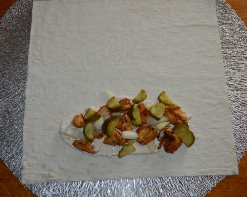 add a layer of onions and pickled cucumbers
