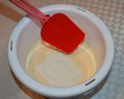 add half of the mixture and gently fold it in with a spatula