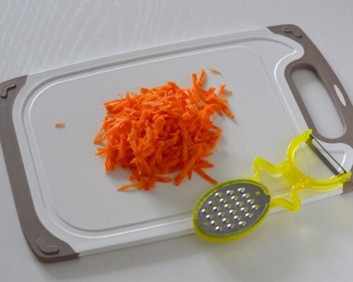 Peel the carrots and grate