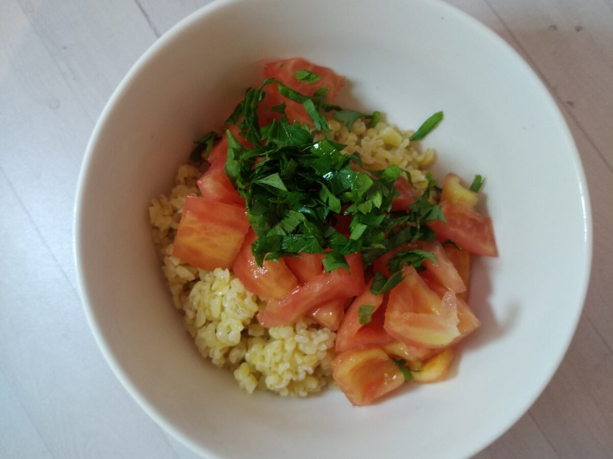Close-up of vibrant herb salad with bulgur and lemon dressing