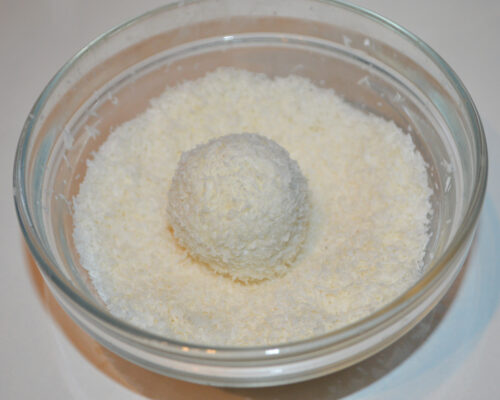 Then roll each ball in coconut flakes